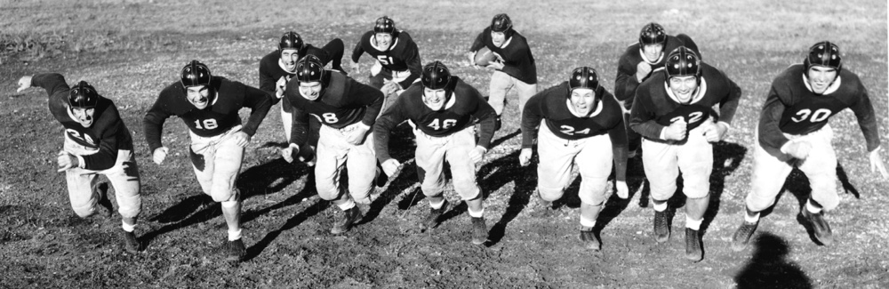 A group photo of the TCU football team in uniform in 1938