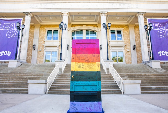 Spectrum painted door in front of library