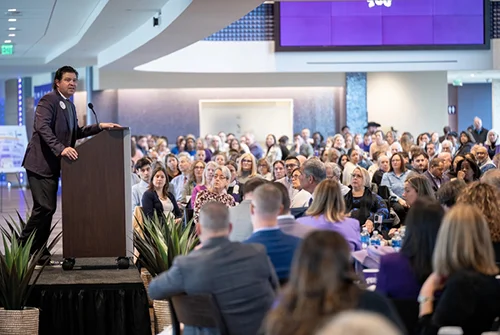 Chancellor Pullin addressing a large crowd of faculty and staff